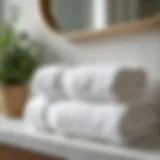 Luxurious cotton towels arranged elegantly on a bathroom shelf