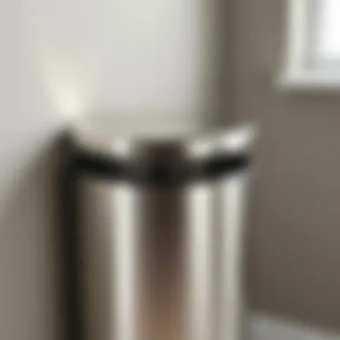 Close-up of the polished finish on a nickel bathroom trash can